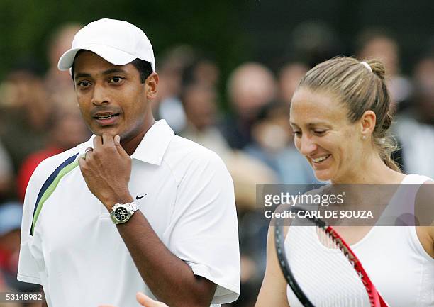 United Kingdom: Mahesh Bhupathi of India and Mary Pierce of France walk togther during their mixed doubles match against David Sherwood and Amanda...