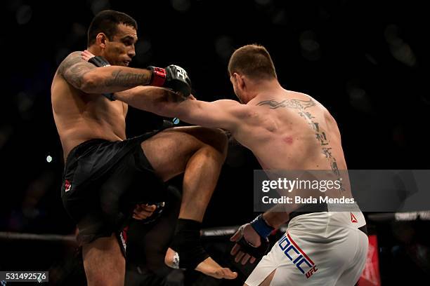 Fabricio Werdum of Brazil competes Stipe Miocic of the United States in their heavyweight bout during the UFC 198 at Arena da Baixada stadium on May...