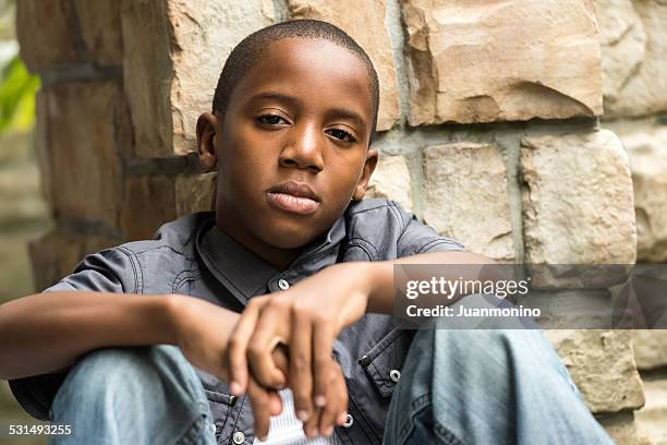 serious eleven years old kid - serious teenager boy stock pictures, royalty-free photos & images