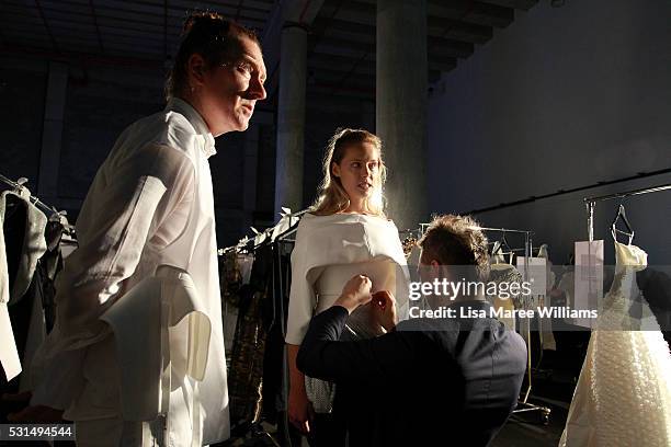 Designer Toni Maticevski prepares a model backstage ahead of the Mercedes-Benz Presents Maticevski show at Mercedes-Benz Fashion Week Resort 17...