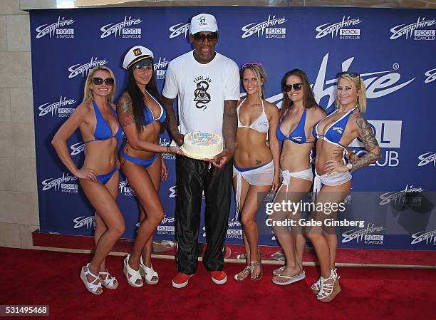 Former NBA player Dennis Rodman poses with models and a birthday cake at Sapphire Pool & Day Club to celebrate his birthday on May 14, 2016 in Las...