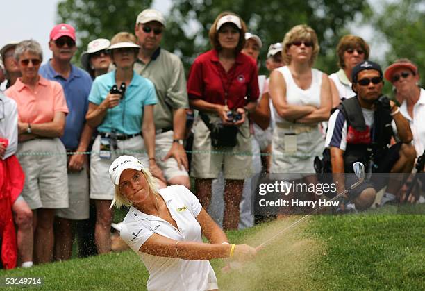 Nicole Perrot of Chile hits out of the bunker on the third hole during the third round of the 60th U.S. Women's Open Championship at Cherry Hills...