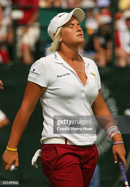 Nicole Perrot of Chile reacts to her 7 over par round on the eighteenth green after the third round of the 60th U.S. Women's Open Championship at...