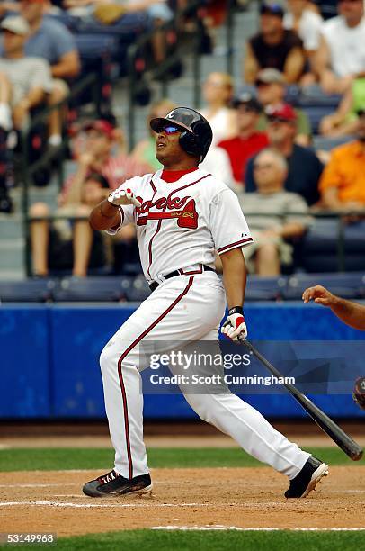 Andruw Jones of the Atlanta Braves follows through on the game winning home run against the Baltimore Orioles at Turner Field on June 25, 2005 in...