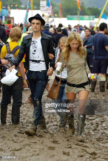 Pete Doherty and Kate Moss are seen on the third day of the Glastonbury Music Festival 2005 at Worthy Farm, Pilton on June 25, 2005 in Somerset,...