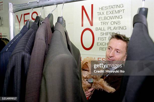 Simon Doonan, creative ambassador-at-large of the New York City-based clothing store Barneys, with his dog Liberace, at Barneys Warehouse Sale in...