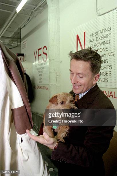 Simon Doonan, creative ambassador-at-large of the New York City-based clothing store Barneys, with his dog Liberace, at Barneys Warehouse Sale in...