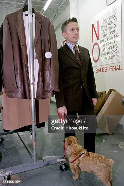 Simon Doonan, creative ambassador-at-large of the New York City-based clothing store Barneys, with his dog Liberace, at Barneys Warehouse Sale in...