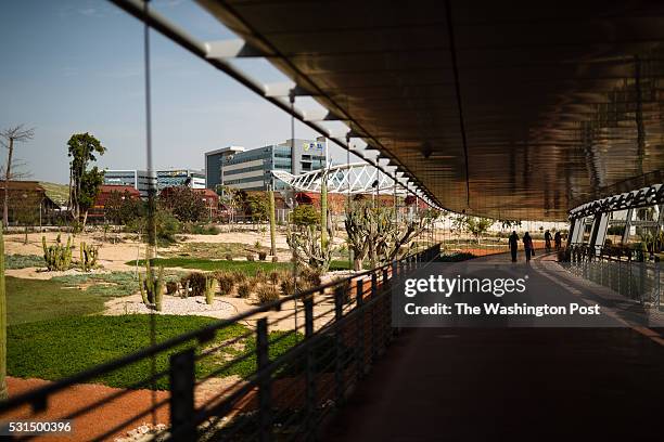 March 9: People are silhouetted as they walk along a shaded walkway connecting the Ben-Gurion University of the Negev to Gav-Yam Negev Advanced...