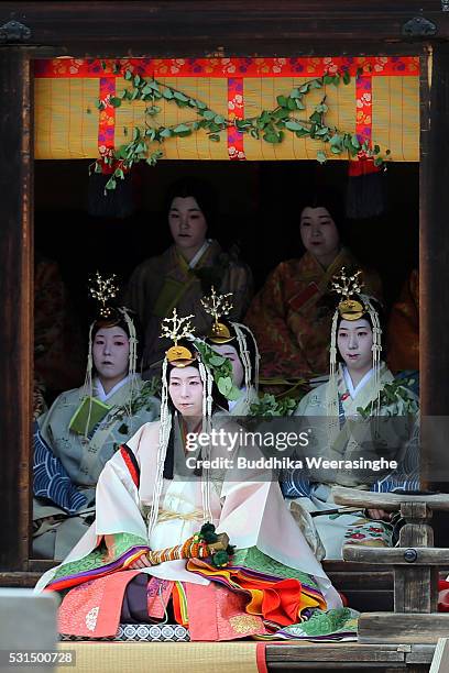 The 'SAoi-dai' queen, principle figure of festival wearing a 12-layered ceremonial kimono of Heian Period court ladies called Junihitoe, sits on...