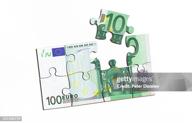 euro note with jigsaw piece - one hundred euro note stock pictures, royalty-free photos & images