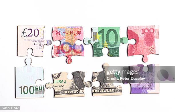 jigsaw banknote pieces - global games london stock-fotos und bilder