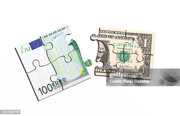 euro note and us dollar note jigsaw - euro dollar stockfoto's en -beelden