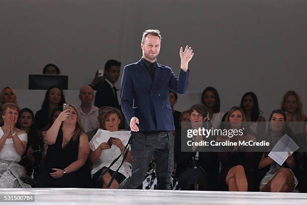 Designer Toni Maticevski waves to the crowd following the Mercedes-Benz Presents Maticevski show at Mercedes-Benz Fashion Week Resort 17 Collections...
