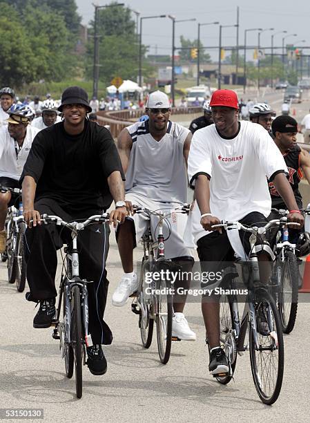 Lebron James of the Cleveland Cavaliers , Dwyane Wade of the Miami Heat , and Carmelo Anthony of the Denver Nuggets participate in the Lebron James...