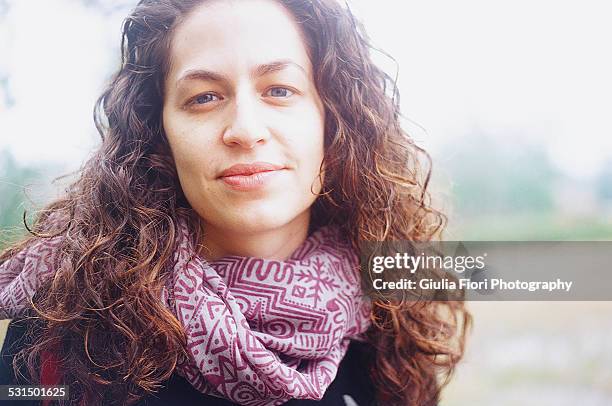 portrait of woman looking at camera - leanincollection stock pictures, royalty-free photos & images