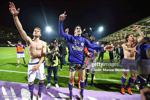 Yan Bodiger and Alexis Blin of Toulouse celebrate after the football french Ligue 1 match between Angers SCO and Toulouse FC on May 14, 2016 in...