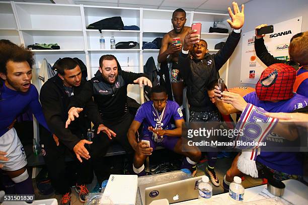 Players of Toulouse celebrate in the cloakroom after the football french Ligue 1 match between Angers SCO and Toulouse FC on May 14, 2016 in Angers,...