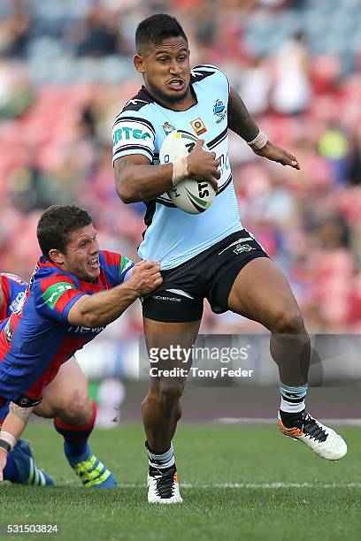 Ben Barba of the Sharks is tackled by the Knights defence during the round 10 NRL match between the Newcastle Knights and the Cronulla Sharks at...