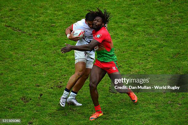 Martin Iosefo of USA is tackled by Aderito Tiny Gloria Esteves of Portugal during the Bowl Quarter Final match between the USA and Portugal on day...