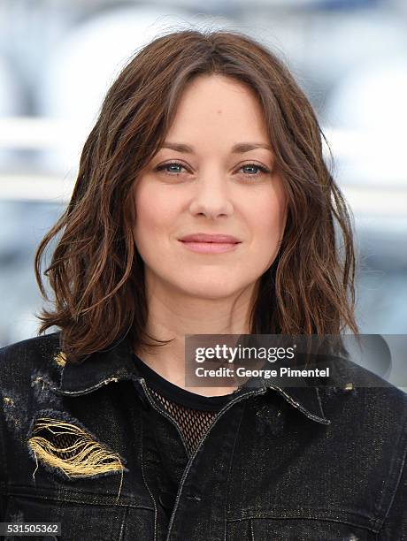 Actress Marion Cotillard attends the "From The Land Of The Moon " Photocall at the annual 69th Cannes Film Festival at Palais des Festivals on May...