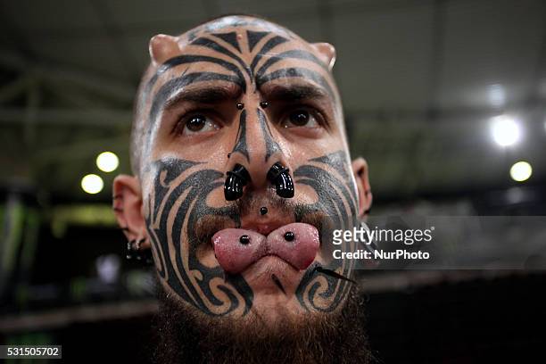 Man with tattoo on his face, piercing, tongue splitting and head... News  Photo - Getty Images