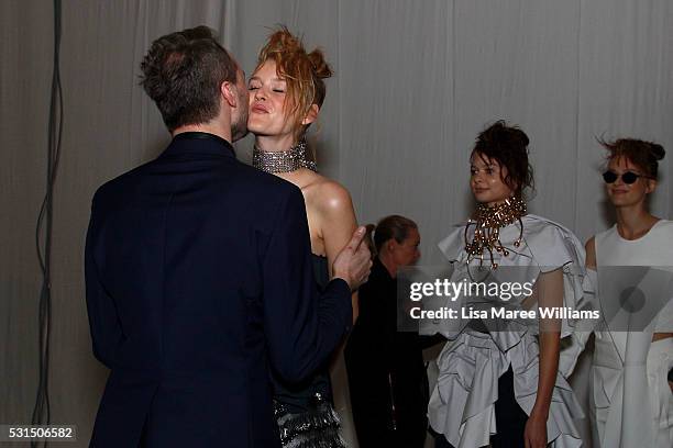 Designer Toni Maticevski celebrates with models backstage following the Mercedes-Benz Presents Maticevski show at Mercedes-Benz Fashion Week Resort...