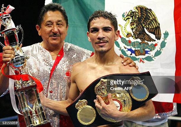 Champion Martin Castillo of Mexico celebrates his victory over challenger Hideyasu Ishihara of Japan after the World Boxing Association Super...