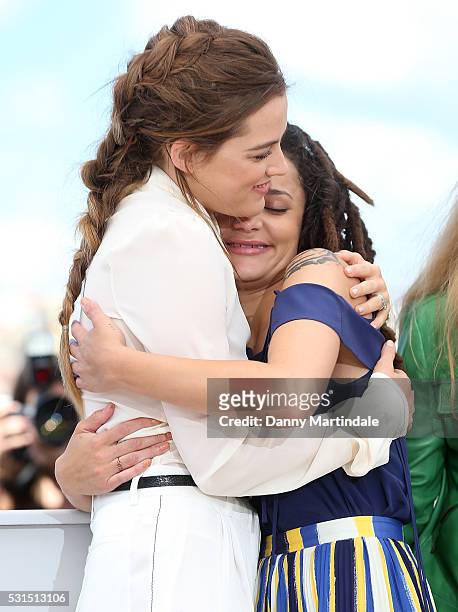 Actress Riley Keough and Sasha Lane embrace during the 'American Honey' photocall during the 69th annual Cannes Film Festival at the Palais des...