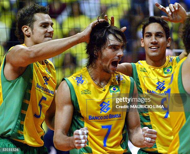 Brazil's Giba celebrates with teammates Henrique and Andre a point against Japan during a World League 2005 volleyball match, in Sao Paulo, Brazil,...