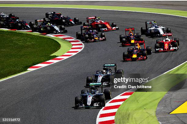 Nico Rosberg of Germany driving the Mercedes AMG Petronas F1 Team Mercedes F1 WO7 Mercedes PU106C Hybrid turbo leas Lewis Hamilton of Great Britain...