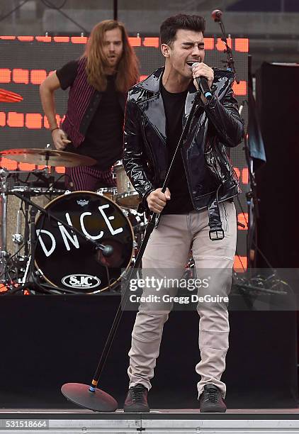 Singer Joe Jonas and drummer Jack Lawless of DNCE perform at 102.7 KIIS FM's Wango Tango 2016 at StubHub Center on May 14, 2016 in Carson, California.
