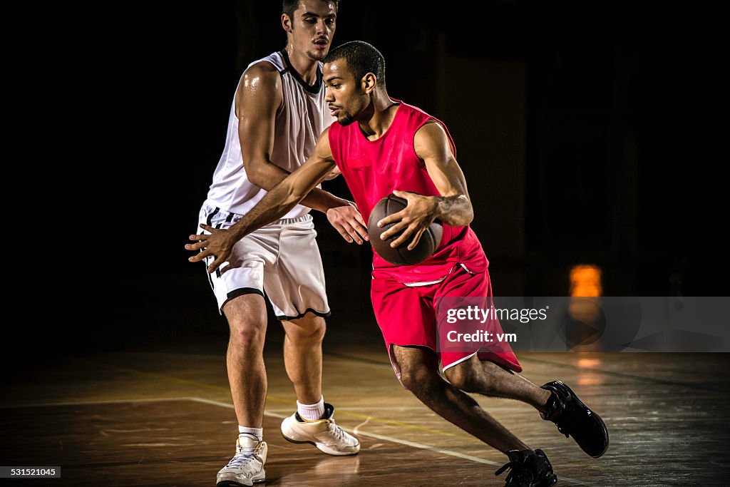 Young Men Playing Basketball