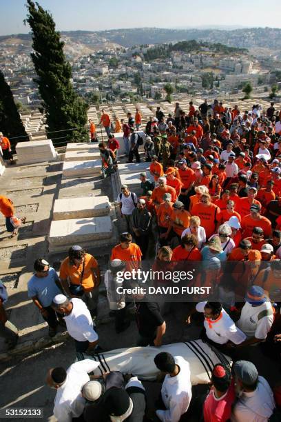 Israeli mourners carry the body of Avichai Levi from the southern West Bank Settlement of Beit Hagay, during his funeral procession at the Mount of...