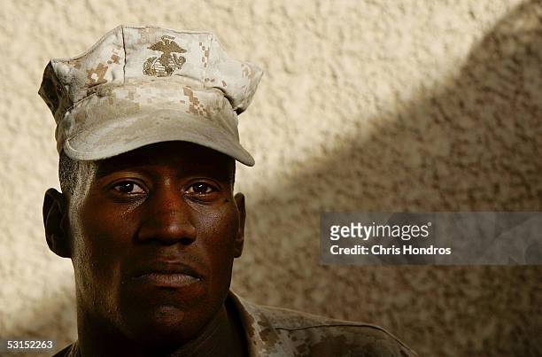 Marine Gunnery Sgt. Ron Brown, from Vidalia, Louisiana, poses at the Third Battalion, Fourth Marines field base June 26, 2005 in Fallujah, Iraq....