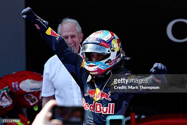 Max Verstappen of Netherlands and Red Bull Racing celebrates his first win in parc ferme with Red Bull Racing Team Consultant Dr Helmut Marko during...