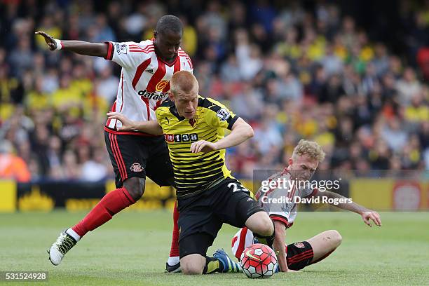 Ben Watson of Watford is challenged by Rees Greenwood and Dame N'Doye of Sunderlandduring the Barclays Premier League match between Watford and...