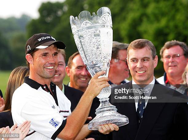 Padraig Harrington of Ireland poses with the trophy next to Prince Andrew after winning the Barclays Classic with a score of 10-uner par on June 26,...