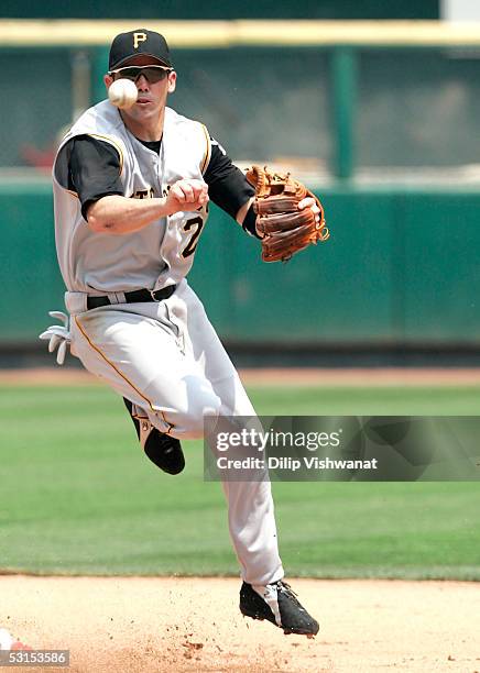 Jack Wilson of the Pittsburgh Pirates throws to first base against the St. Louis Cardinals at Busch Stadium on June 26, 2005 in St. Louis, Missouri....