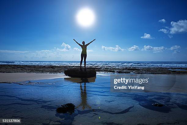 woman yoga exercise in nature with sea and sky background - sun salutation stock pictures, royalty-free photos & images