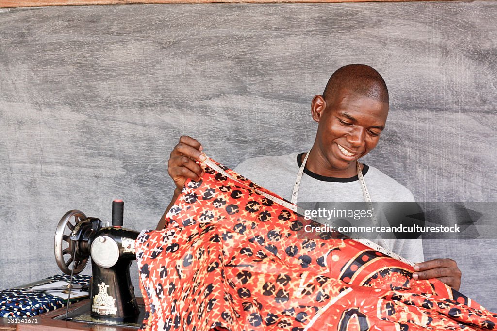 A tailor measuring a loincloth