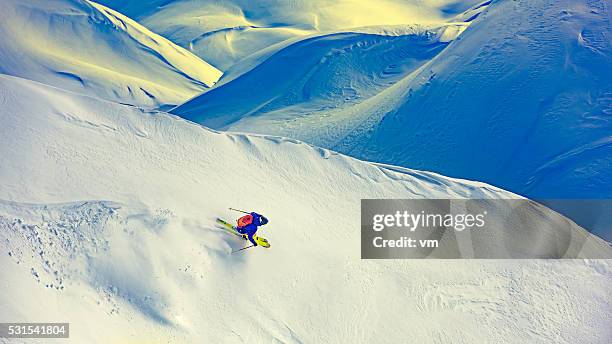 Skier skiing off-piste on a beatiful mountain slope