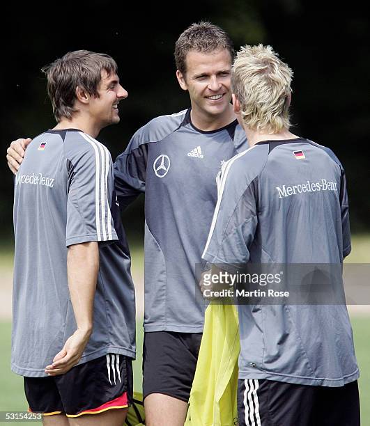 Oliver Bierhoff Team manager of Germany talks to Sebastian Deisler and Bastian Schweinsteiger during the training session of the German National Team...