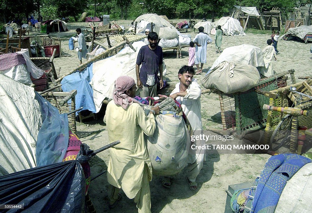 Afghan refugees salvage their belongings