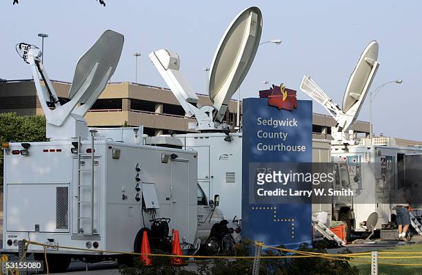 News media satellite trucks from across the country are set up outside the Sedgwick County Courthouse on the first day of the trial of Dennis L....