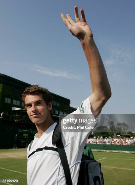 Andrew Murray of Great Britain arrives on court three with his mixed doubles partner Shahar Peer of Israel as they take on Lucas Arnold of Argentina...