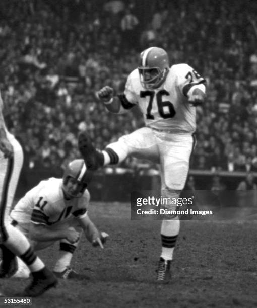 Kicker Lou Groza, of the Cleveland Browns, follows through on a kick during the game on November 15, 1964 against the Detroit Lions at Municipal...