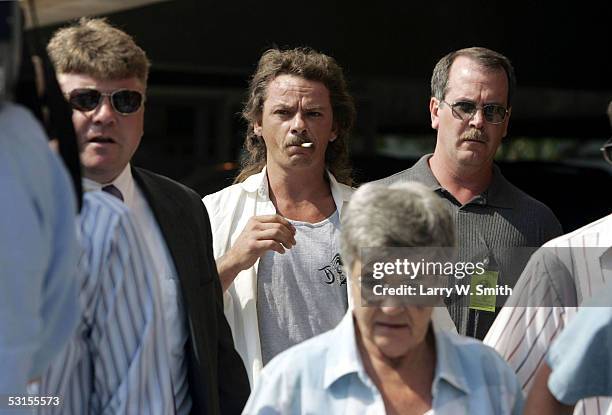 Steven Relford , whose mother was killed by the BTK serial killer, leaves the Sedgwick County Courthouse after Dennis L. Rader, the man accused of...