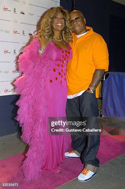 Radio Personality Wendy Williams and husband pose at the release party for Wendy Williams Brings The Heat, Vol. 1 at Quo on June 22, 2005 in New York...