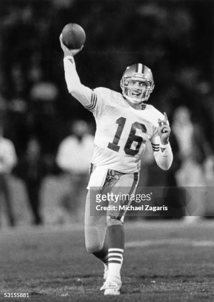 Joe Montana of the San Francisco 49ers throws a pass against the Los Angeles Rams during the game at Anaheim Stadium on December 11, 1989 in Anaheim,...